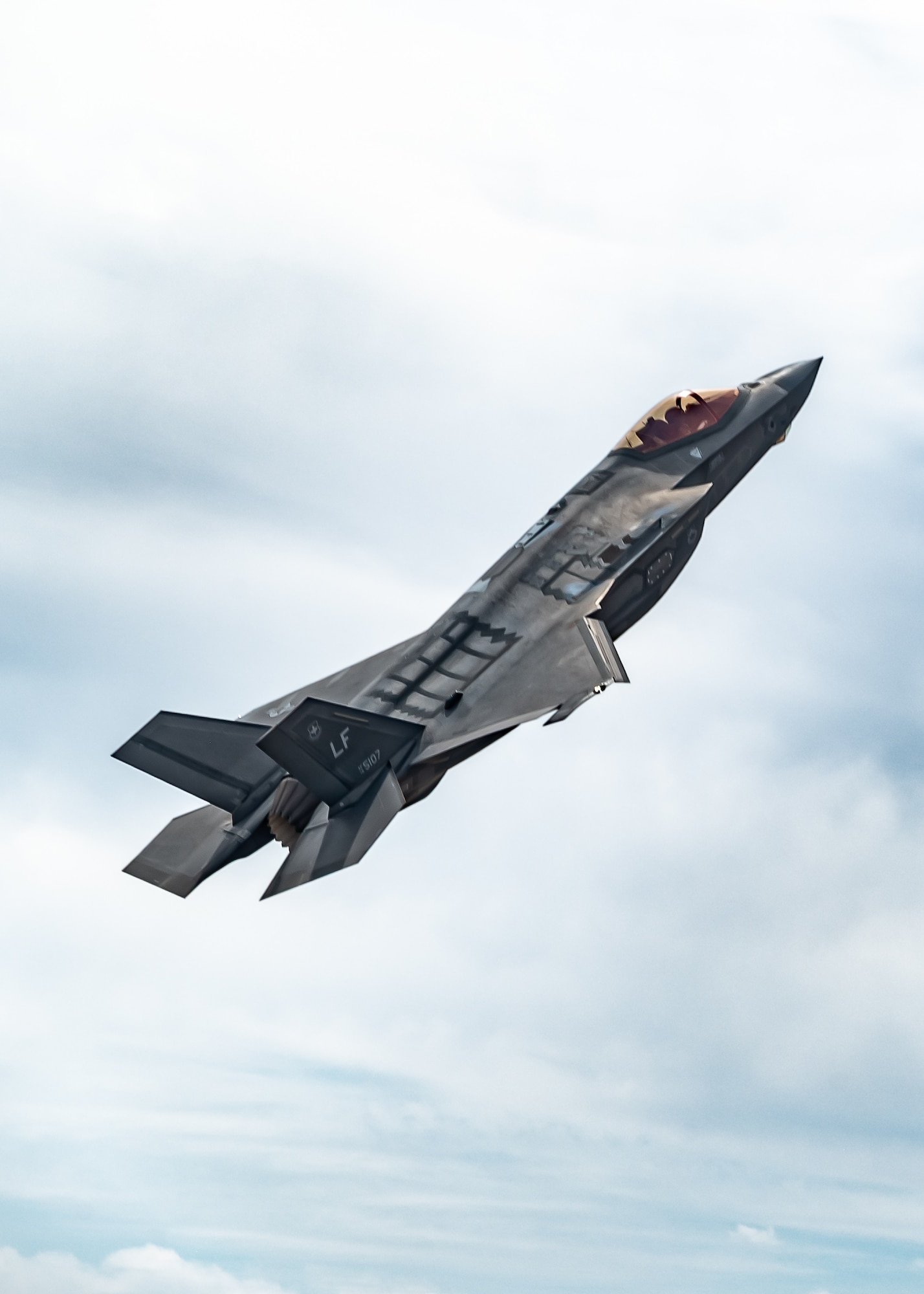 A U.S. Air Force F-35A Lightning II aircraft assigned to the 56th Fighter Wing performs a vertical climb