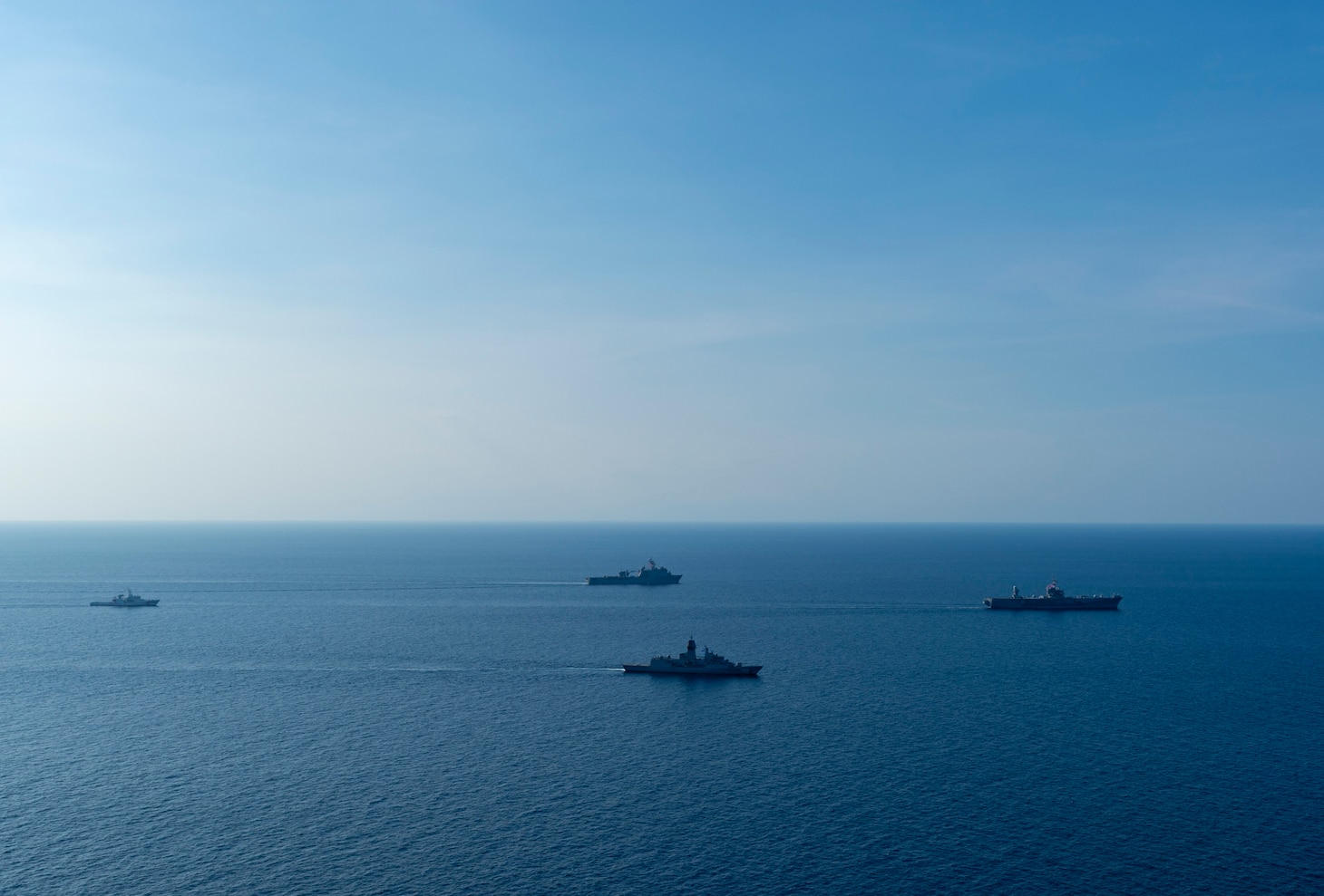 From left: Philippine Coast Guard Boracay-class patrol boat BRP Boracay (FPB-2401), U.S. Navy Whidbey Island-class dock landing ship USS Ashland (LSD 48), Royal Australian Navy Anzac-class frigate HMAS Toowoomba (FF 156), and U.S. 7th Fleet flagship USS Blue Ridge (LCC 19) conduct a group sail during a multilateral exercise with the Armed Forces of the Philippines and Royal Australian Navy in the Sulu Sea, April 13, 2026. U.S. 7th Fleet, the U.S. Navy’s largest forward-deployed numbered fleet, routinely interacts and operates with allies and partners in preserving a free and open Indo-Pacific. (U.S. Navy Photo by Mass Communication Specialist Seaman Nicholas Douglass)