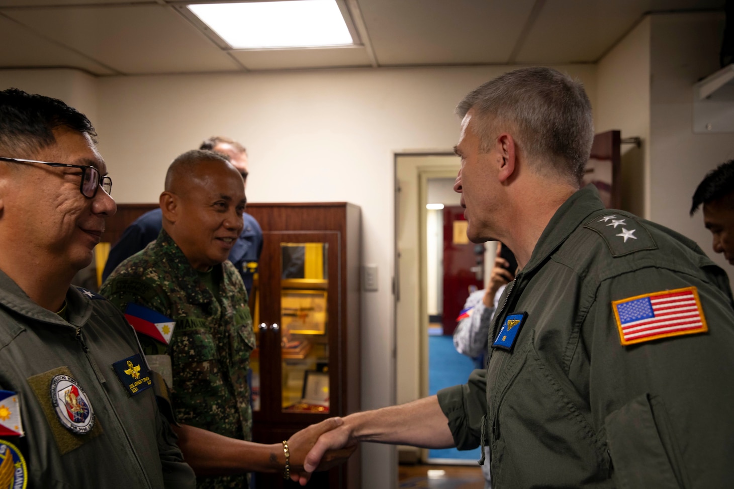 U.S. 7th Fleet Commander Vice Adm. Pat Hannifin shakes hands with Philippine Marine Corps 3d Marine Brigade Commander Brig. Gen. Wilredo B. Manalang Jr. aboard U.S. 7th Fleet flagship USS Blue Ridge (LCC 19) during a multilateral exercise with the Armed Forces of the Philippines and Royal Australian Navy in the Sulu Sea, April 13, 2026. U.S. 7th Fleet, the U.S. Navy’s largest forward-deployed numbered fleet, routinely interacts and operates with allies and partners in preserving a free and open Indo-Pacific. (U.S. Navy Photo by Mass Communication Specialist 1st Class Caitlin Flynn)