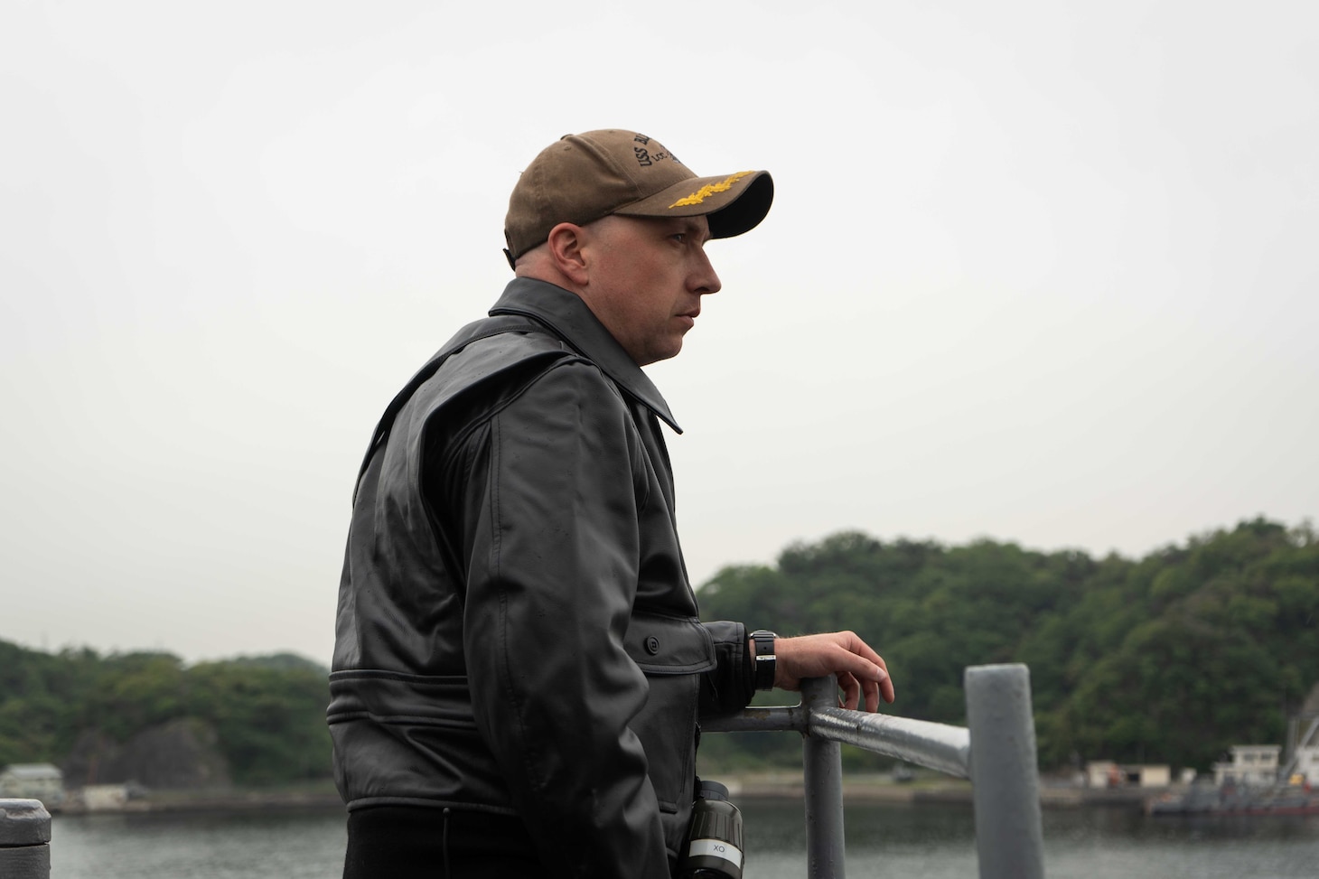U.S. 7th Fleet flagship USS Blue Ridge (LCC 19) Executive Officer Cmdr. Daniel Woods watches for other vessels on the bridge wing of Blue Ridge as the ship returns to Commander, Fleet Activities Yokosuka, Japan following a patrol in the Indo-Pacific region, April 23, 2026.