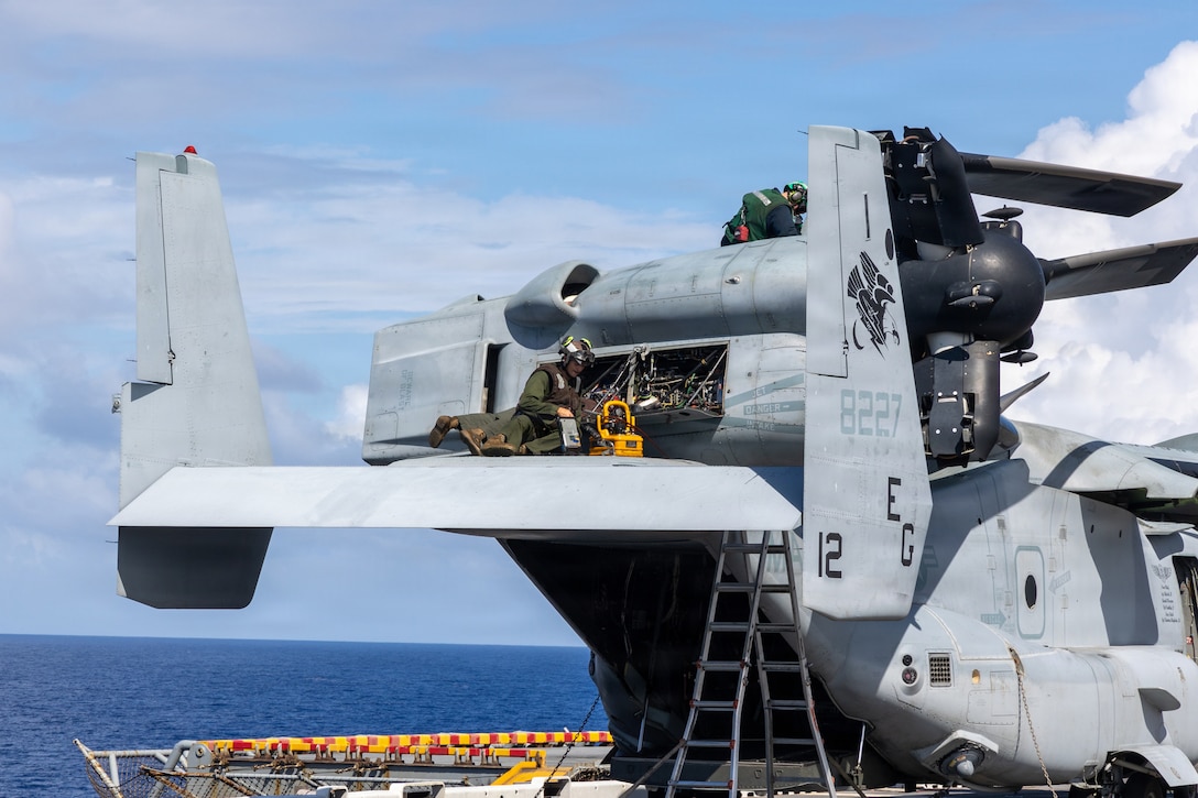 U.S. Marines with Marine Medium Tiltrotor Squadron (VMM) 263 (Reinforced), 22nd Marine Expeditionary Unit (Special Operations Capable), conduct maintenance on a MV-22B Osprey tiltrotor aircraft aboard Wasp-class amphibious assault ship USS Iwo Jima (LHD 7) while underway in the Caribbean Sea, April 18, 2026. U.S. military forces are deployed to the Caribbean in support of the U.S. Southern Command mission, Department of War-directed operations, and the president’s priorities to disrupt illicit drug trafficking and protect the homeland. (U.S. Marine Corps photo)