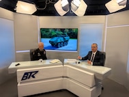 Brig. Gen. Paul Sellars, commanding general, Washington Army National Guard, sits down with Evgeni Mandadzhiev, reporter with the Ministry of Defense Information Center, to introduce the Stryker Fighting Vehicles and discuss the role of the National Guard in supporting the Bulgarian Land Forces, April 15, 2026, Sofia, Bulgaria.
