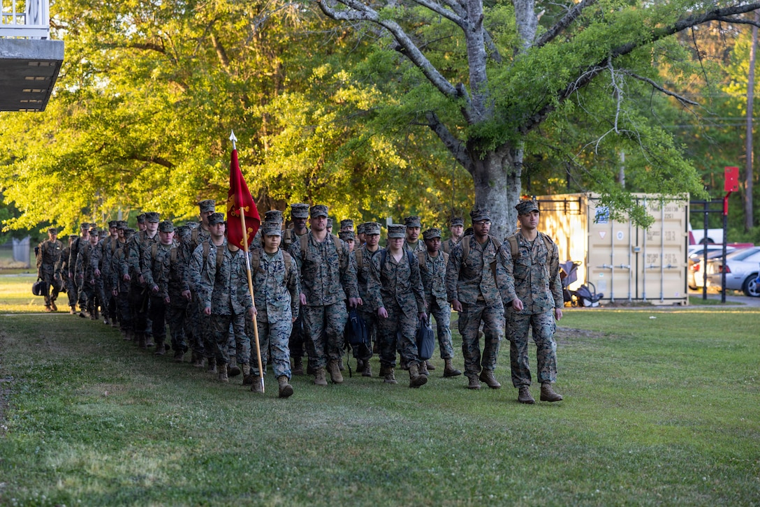 U.S. Marines and Sailors with Combat Logistics Battalion 6, Combat Logistics Regiment 2, 2nd Marine Logistics Group, march in formation during a deployment homecoming event at Marine Corps Base Camp Lejeune, North Carolina, April 21, 2026. During the six-month deployment, CLB-6 supported two multi-national exercises in two different countries to strengthen regional security and Allied and partner integration as part of Marine Rotational Force-Europe. (U.S. Marine Corps photo by Sgt. Rafael Brambila-Pelayo)