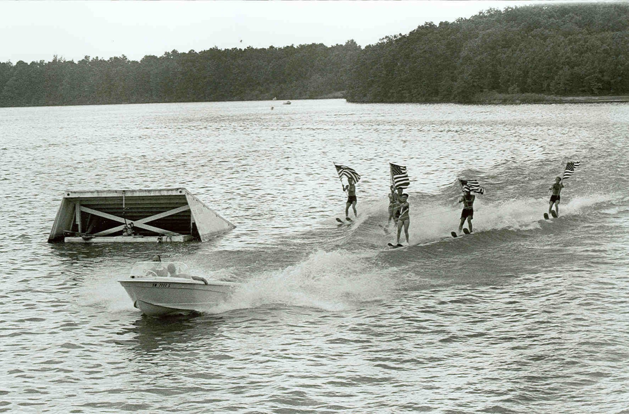 A ski club performs on Woods Reservoir during the 14th annual Arnold Engineering Development Center Family Picnic in 1968. Woods Reservoir, created by the 1952 completion of the Elk River Dam to supply cooling water to Arnold Engineering Development Center test facilities, opened for public fishing and recreation on May 30, 1953. Public use of the manmade lake was a topic of focus for then-AEDC Commander Brig. Gen. Samuel Harris following construction of the dam and leading up to the dedication of the waterbody as Woods Reservoir in July 1953. (U.S. Air Force photo)