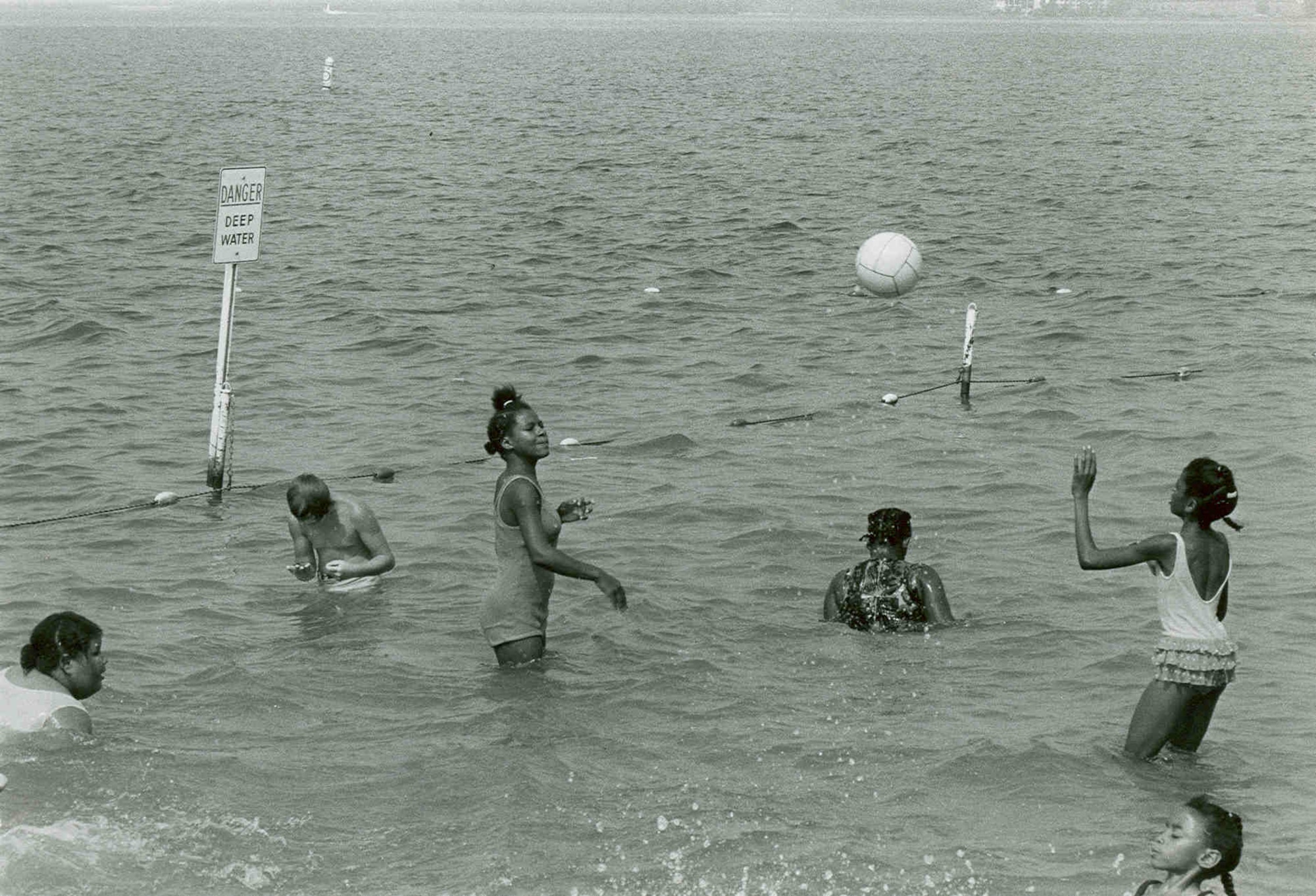 Children play in the water near the Woods Reservoir beach in 1975. Woods Reservoir, created by the 1952 completion of the Elk River Dam to supply cooling water to Arnold Engineering Development Center test facilities, opened for public fishing and recreation on May 30, 1953. Public use of the manmade lake was a topic of focus for then-AEDC Commander Brig. Gen. Samuel Harris following construction of the dam and leading up to the dedication of the waterbody as Woods Reservoir in July 1953. (U.S. Air Force photo)