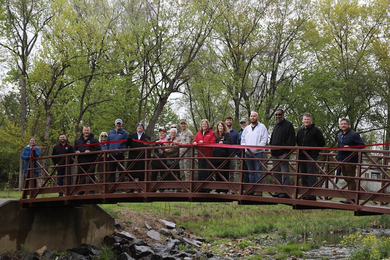 U.S. Army Corps of Engineers employees and Abington Township representatives and officials gather for a ribbon cutting at Grove Run Dog Park in Abington, PA.