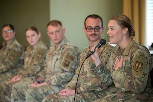 A group of individuals stand in front of the "Centrifuge" for a photo.