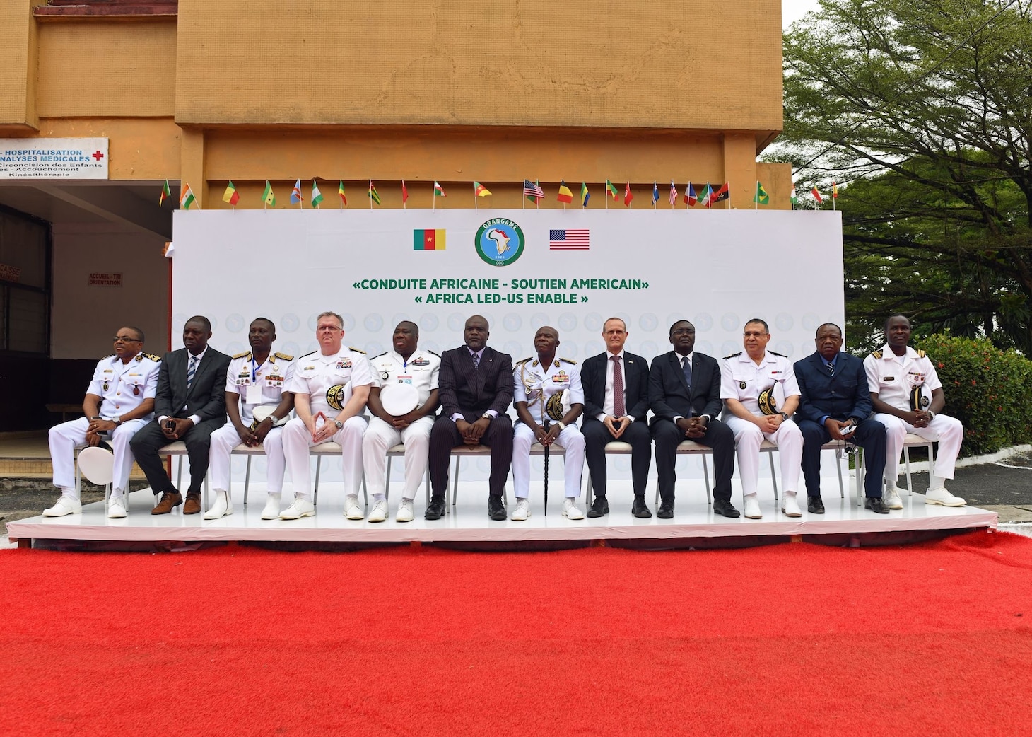 Leaders from the United States and West Africa pose for a group photo during the opening ceremony of Obangame Express 26.