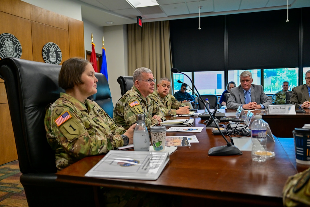 People sitting around a conference room table.