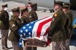 The New Mexico Army National Guard Funeral Honors Team rendered planeside honors for U.S. Army Cpl. Richard A. Veal, a New Mexico National Guard Soldier who fought in the defense of Bataan during World War II. Veal returned home to New Mexico April 21, 2026. Photo by Iain Jaramillo.