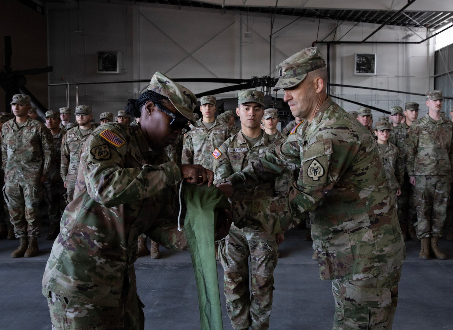 U.S. Army Capt. Jamee Finley, left, and 1st Sgt. Paul Jones, right, the company command team for the 150th Maintenance Company, case the colors at the Washoe County Armory in Stead, Nevada, April 18, 2026.
