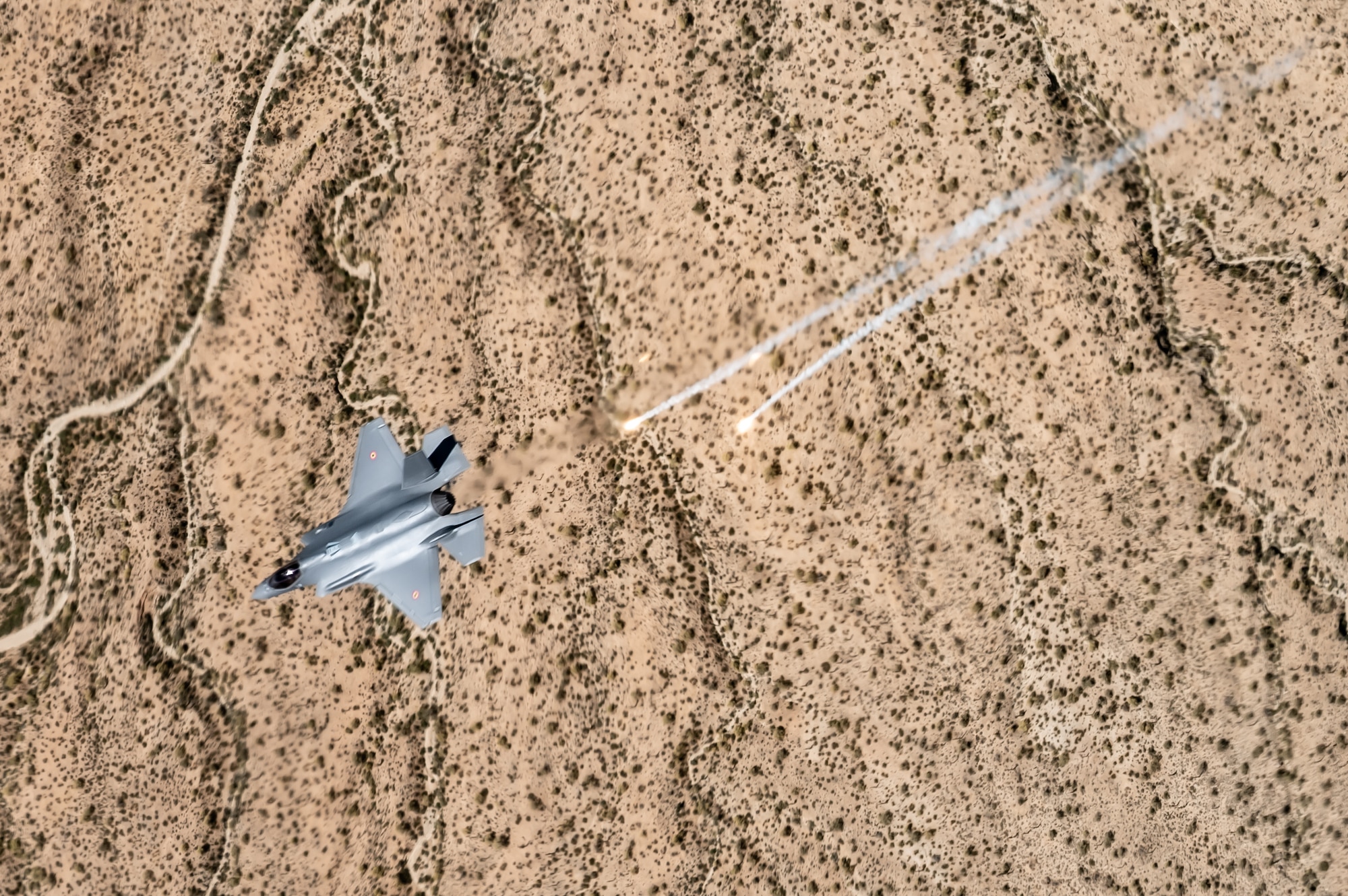 A Belgian Air Component F-35A Lightning II assigned to the 56th Fighter Wing deploys flares over the Sonoran Desert