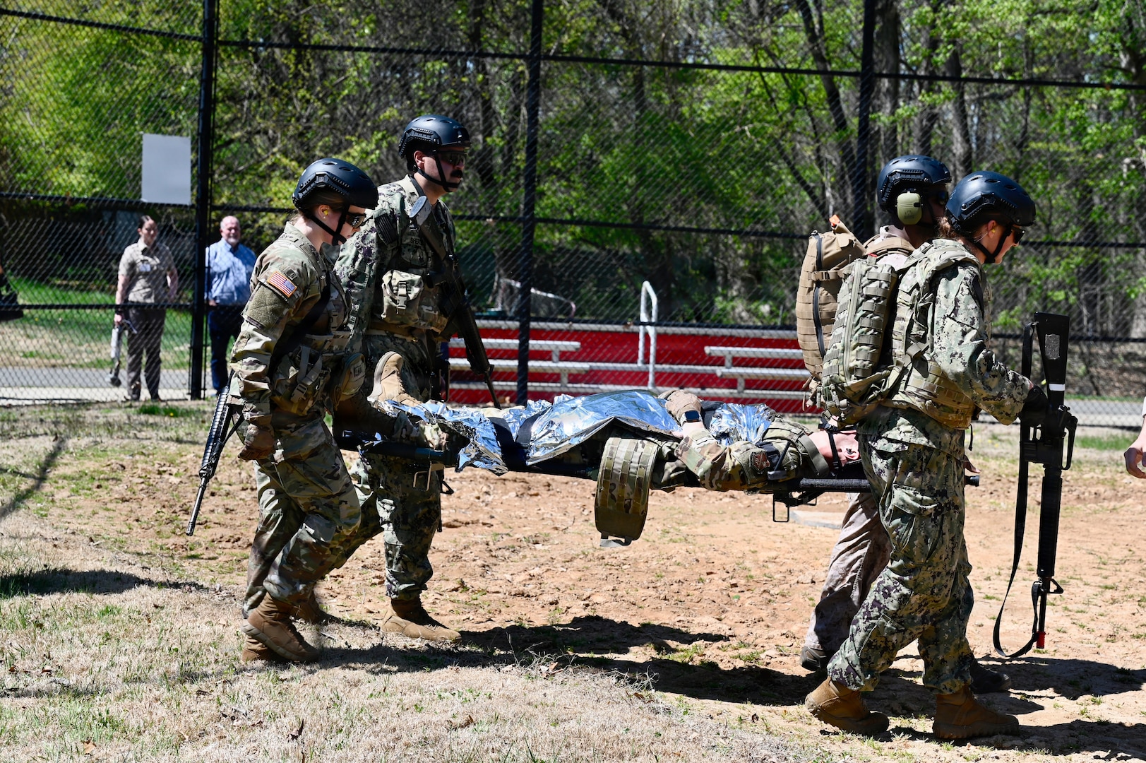 First-year medical students at the Uniformed Services University of the Health Sciences conduct a medical evacuation training exercise with a UH-60L MEDEVAC Black Hawk assigned to the D.C. Army National Guard Aviation Battalion in Bethesda, Maryland, on April 10, 2026. The training provided medical school applicants and first-year medical students with instruction in medical evacuation procedures and tactical combat casualty care (TCCC).