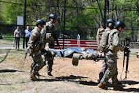 First-year medical students at the Uniformed Services University of the Health Sciences conduct a medical evacuation training exercise with a UH-60L MEDEVAC Black Hawk assigned to the D.C. Army National Guard Aviation Battalion in Bethesda, Maryland, on April 10, 2026. The training provided medical school applicants and first-year medical students with instruction in medical evacuation procedures and tactical combat casualty care (TCCC).