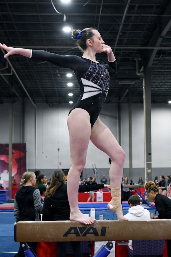Department of War Education Activity (DoWEA) Lejeune High School junior Haley Cochran performs on the balance beam during a gymnastics competition. Cochran, a Level 9 gymnast, recently qualified for the USA Gymnastics Eastern National Championships while balancing rigorous training, academics and the demands of a military family lifestyle. DoWEA operates as a field activity of the Office of the Secretary of War. It is responsible for planning, directing, coordinating, and managing prekindergarten through 12th-grade educational programs for the Department of War. DoWEA operates 161 accredited schools in 9 districts in 11 foreign countries, seven states, Guam, and Puerto Rico, serving over 66,000 military-connected students. DoWEA Americas operates 50 accredited schools across two districts on 16 military installations, including Army, Navy, Marine Corps, Air Force, and Coast Guard bases in seven states, Puerto Rico and Cuba. Committed to excellence in education, DoWEA fosters well-rounded, lifelong learners through DoWEA’s academic programs, ensuring continued innovation and excellence, while advancing a strong focus on patriotism, classical learning, and civics education in support of military-connected students worldwide.