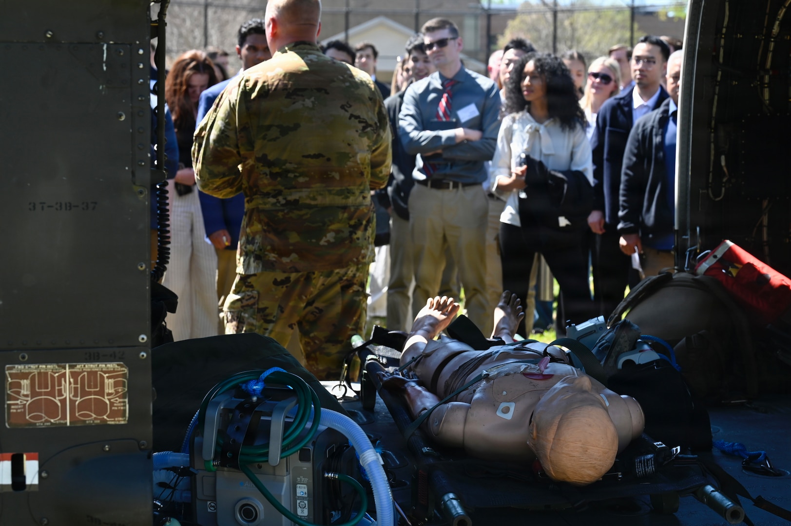 First-year medical students at the Uniformed Services University of the Health Sciences conduct a medical evacuation training exercise with a UH-60L MEDEVAC Black Hawk assigned to the D.C. Army National Guard Aviation Battalion in Bethesda, Maryland, on April 10, 2026. The training provided medical school applicants and first-year medical students with instruction in medical evacuation procedures and tactical combat casualty care (TCCC).