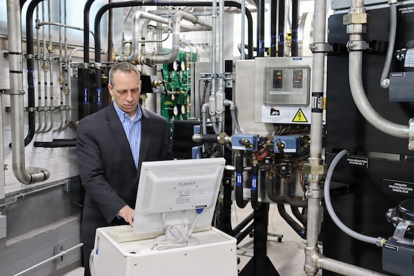 GROTON, Conn (April 21, 2025). Dr. John Florian, head of Naval Submarine Medical Research Laboratory’s (NSMRL) Warfighter Health and Protection department, works the recently renovated Genesis hypo/hyperbaric chamber. Florian also serves as chair for the Five Eyes Science & Technology (FVEY S&T) Human Resources and Performance (HUM) Group Maritime Human Systems Performance Joint Panel (JP2) and U.S. National co-lead. FVEY S&T is an international organization that collaborates on scientific and technical defense research through information exchange, joint experimentation and partnerships. Member nations include the U.S., Australia, Canada, New Zealand and the United Kingdom. NSMRL, part of Navy Medicine Research & Development and based out of Groton, Connecticut, sustains the readiness and superiority of U.S. undersea warfighters through innovative health and performance research and works to lead the world in delivering science solutions to ensure undersea warrior dominance. (U.S. Navy photo by Emily Swedlund /Released)