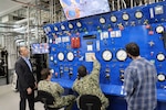 GROTON, Conn (April 21, 2025) Dr. John Florian (left), head of Naval Submarine Medical Research Laboratory’s (NSMRL) Warfighter Health and Protection department, supervises an ongoing research protocol in NSMRL’s recently renovated Genesis hypo/hyperbaric chamber. NSMRL, part of Navy Medicine Research & Development and based out of Groton, Connecticut, sustains the readiness and superiority of U.S. undersea warfighters through innovative health and performance research and works to lead the world in delivering science solutions to ensure undersea warrior dominance. (U.S. Navy photo by Emily Swedlund/Released)