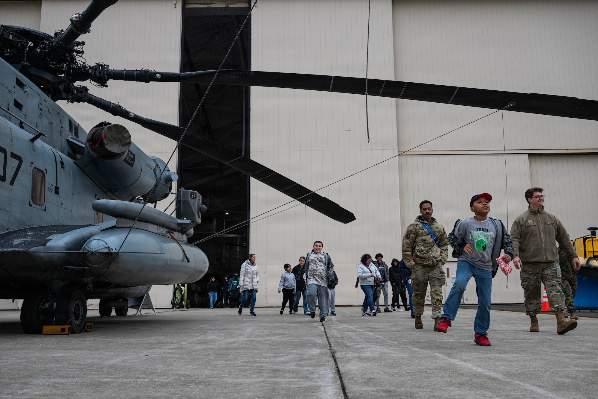 U.S. Airmen assigned to the 621st Contingency Response Wing, along with Students and faculty members of Mercer County Special Services School District, tour static displays at the Special Needs Airshow, April 2, 2026 at Joint Base McGuire-Dix-Lakehurst, New Jersey.