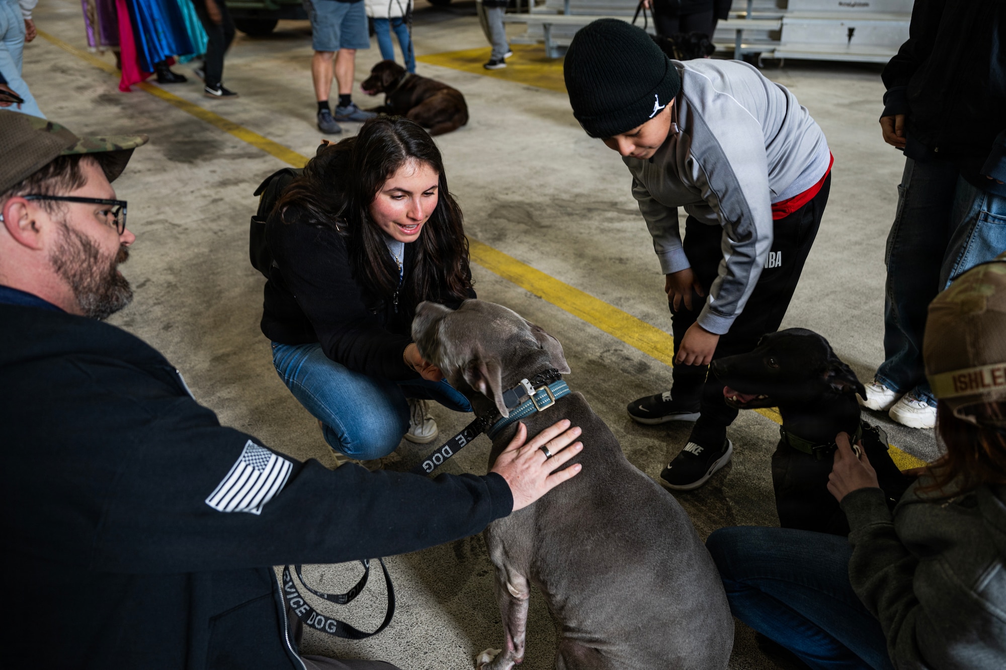 Students and faculty members of Mercer County Special Services School District greet therapy dogs at the Special Needs Airshow, April 2, 2026 at Joint Base McGuire-Dix-Lakehurst, New Jersey.