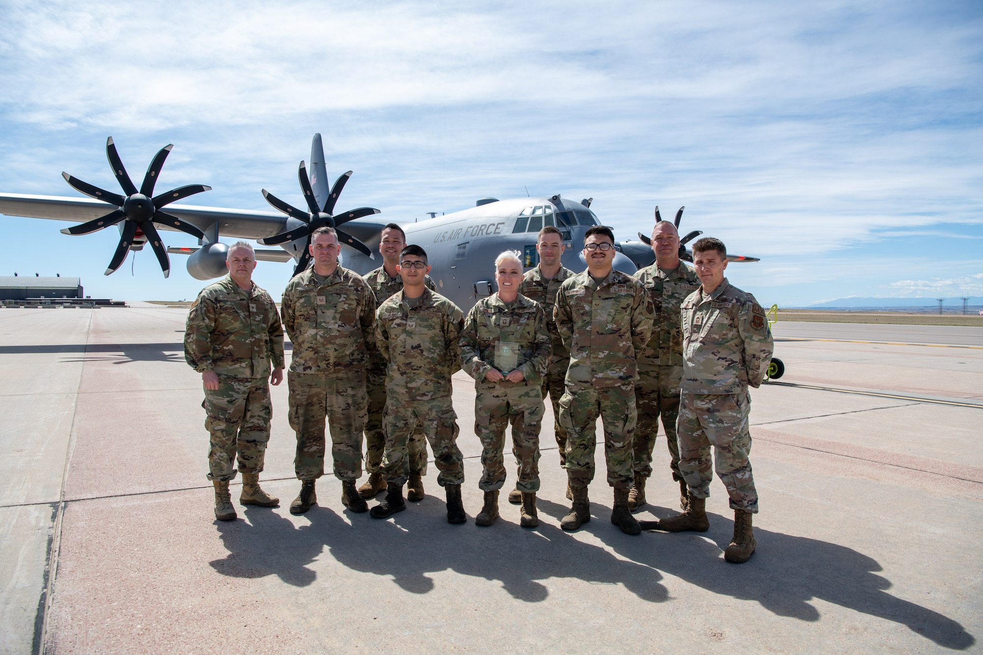 Airmen pose for a photo with their award.