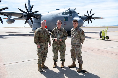 Airmen pose for a photo with their award.