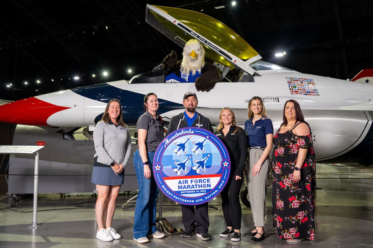 The Air Force Marathon Office celebrates the announcement of the F-16 Thunderbird as the featured aircraft for the 30th Annual Air Force Marathon, scheduled for September 2026. The announcement was made during a news conference on April 22, 2026, at the National Museum of the U.S. Air Force.(U.S. Air Force photo by Jack Gardner)