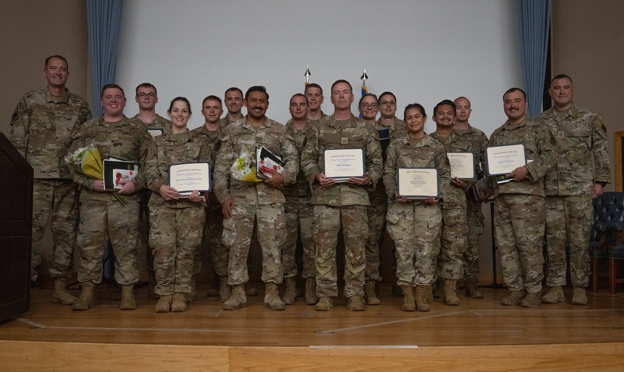The newest Community College of the Air Force graduates and leadership from the 47th Flying Training Wing come together for a group photo at Laughlin Air Force Base, Texas, April 21, 2026. Over 30 U.S. Air Force Airmen received CCAF diplomas during a graduation ceremony. (U.S. Air Force photo by Airman 1st Class Darryl Keith)