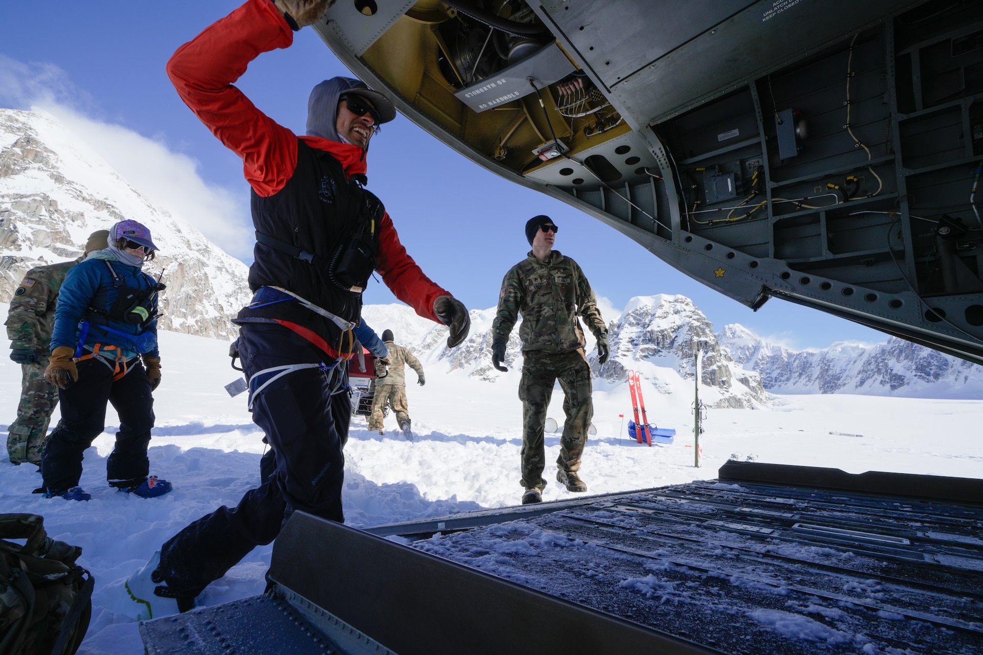Alaska Army National Guard Soldiers and National Park Service personnel assigned to Denali National Park and Preserve’s Denali Rescue Team offload equipment from a CH-47 Chinook at Denali Base Camp on the Kahiltna Glacier, April 14, 2026. Alaska Army National Guard and active-duty CH-47 crews delivered cargo to support the establishment of base camp operations ahead of the climbing season on Mount McKinley, demonstrating heavy-lift capability in a high-altitude environment.