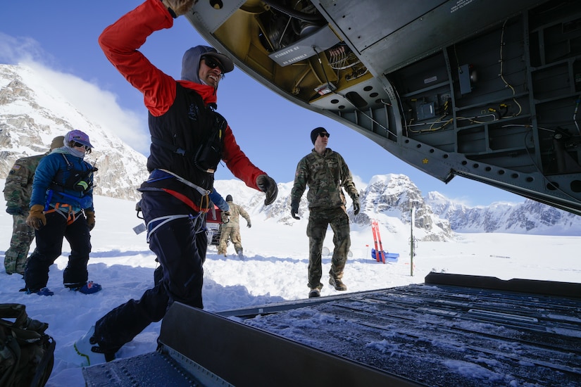 Alaska Army National Guard Soldiers and National Park Service personnel assigned to Denali National Park and Preserve’s Denali Rescue Team offload equipment from a CH-47 Chinook at Denali Base Camp on the Kahiltna Glacier, April 14, 2026. Alaska Army National Guard and active-duty CH-47 crews delivered cargo to support the establishment of base camp operations ahead of the climbing season on Mount McKinley, demonstrating heavy-lift capability in a high-altitude environment.