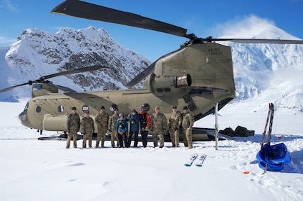 Alaska Army National Guard CH-47F Chinook aircrew members and National Park Service personnel assigned to Denali National Park and Preserve’s Denali Rescue Team offload equipment at Denali Base Camp on the Kahiltna Glacier, April 14, 2026. The crews delivered more than 5,500 pounds of cargo to support the establishment of base camp operations ahead of the climbing season on Mount McKinley.