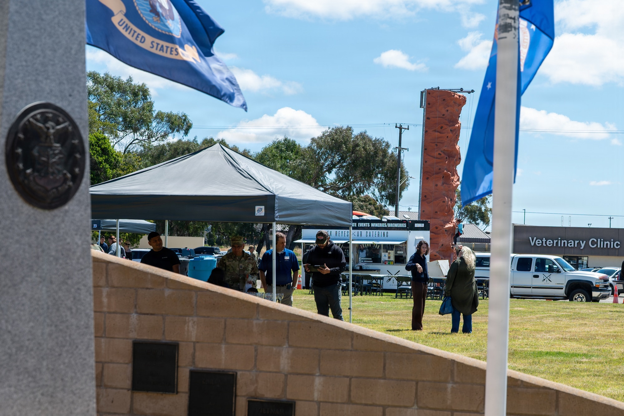 Earth Day Festival tents and outdoor recreation rock wall.