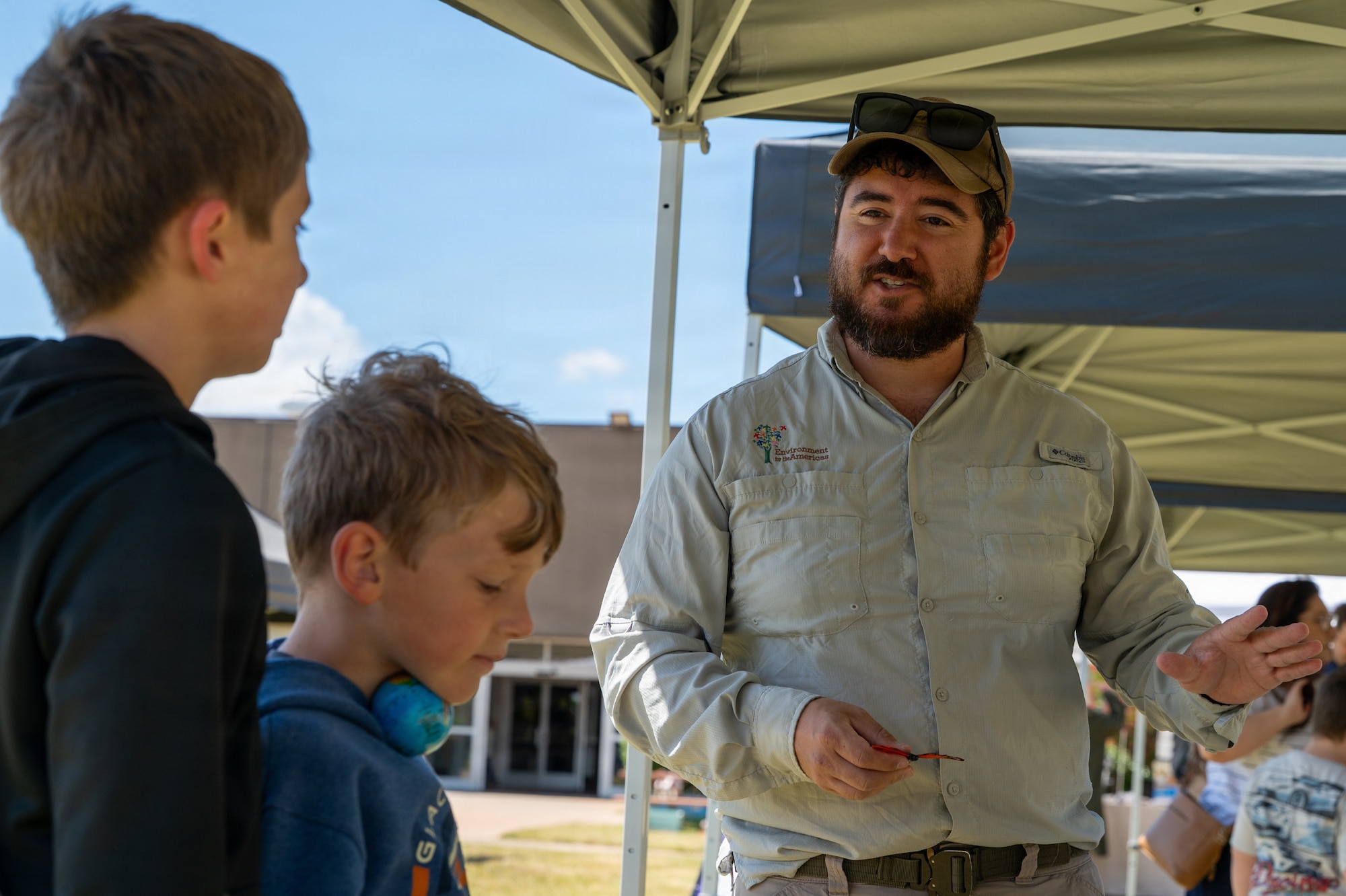Three people engage in discussion.