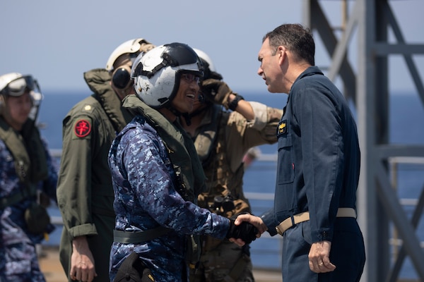 U.S. 7th Fleet Deputy Commander Rear Adm. Kyle Gantt, right, greets Japan Maritime Self-Defense Force (JMSDF) Surface Warfare Squadron 6 Commodore Capt. Jo Takemasa on the U.S. 7th Fleet flagship USS Blue Ridge (LCC 19) flight deck during a bilateral exercise with the JMSDF in the South China Sea, April 16, 2026. U.S. 7th Fleet, the Navy’s largest forward-deployed numbered fleet, routinely interacts and operates with allies and partners in preserving a free and open Indo-Pacific. (U.S. Navy photo by Mass Communication Specialist 1st Class Charles Oki)
