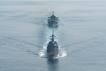 Japan Maritime Self-Defense Force (JMSDF) Asahi-class destroyer JS Asahi (DD-119) and U.S. 7th Fleet flagship USS Blue Ridge (LCC 19) conduct a group sail during a bilateral exercise in the South China Sea, April 16, 2026. U.S. 7th Fleet, the Navy’s largest forward-deployed numbered fleet, routinely interacts and operates with allies and partners in preserving a free and open Indo-Pacific. (U.S. Navy photo by Mass Communication Specialist 3rd Class Damian Cook)