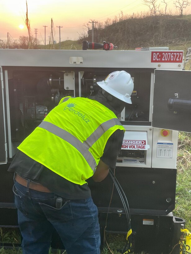 a man inspects a generator