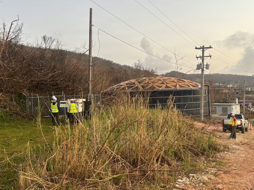 Crews hook up power to a water station