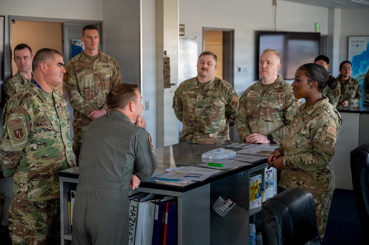 U.S. Air Force Senior Airman Jarese Wilson, right, 35th Operations Support Squadron airfield management shift lead, briefs the 35th Fighter Wing(FW) leaders during a Wild Weasel walk-through at Misawa Air Base, Japan, April 20, 2026. The Wild Weasel of the Week program recognized Wilson for her leadership and dedication to ensuring safe and efficient airfield operations, supporting the 35th Fighter Wing’s mission to maintain combat-ready airpower in the Indo-Pacific region. (U.S. Air Force photo by Airman 1st Class Angelica Winther)