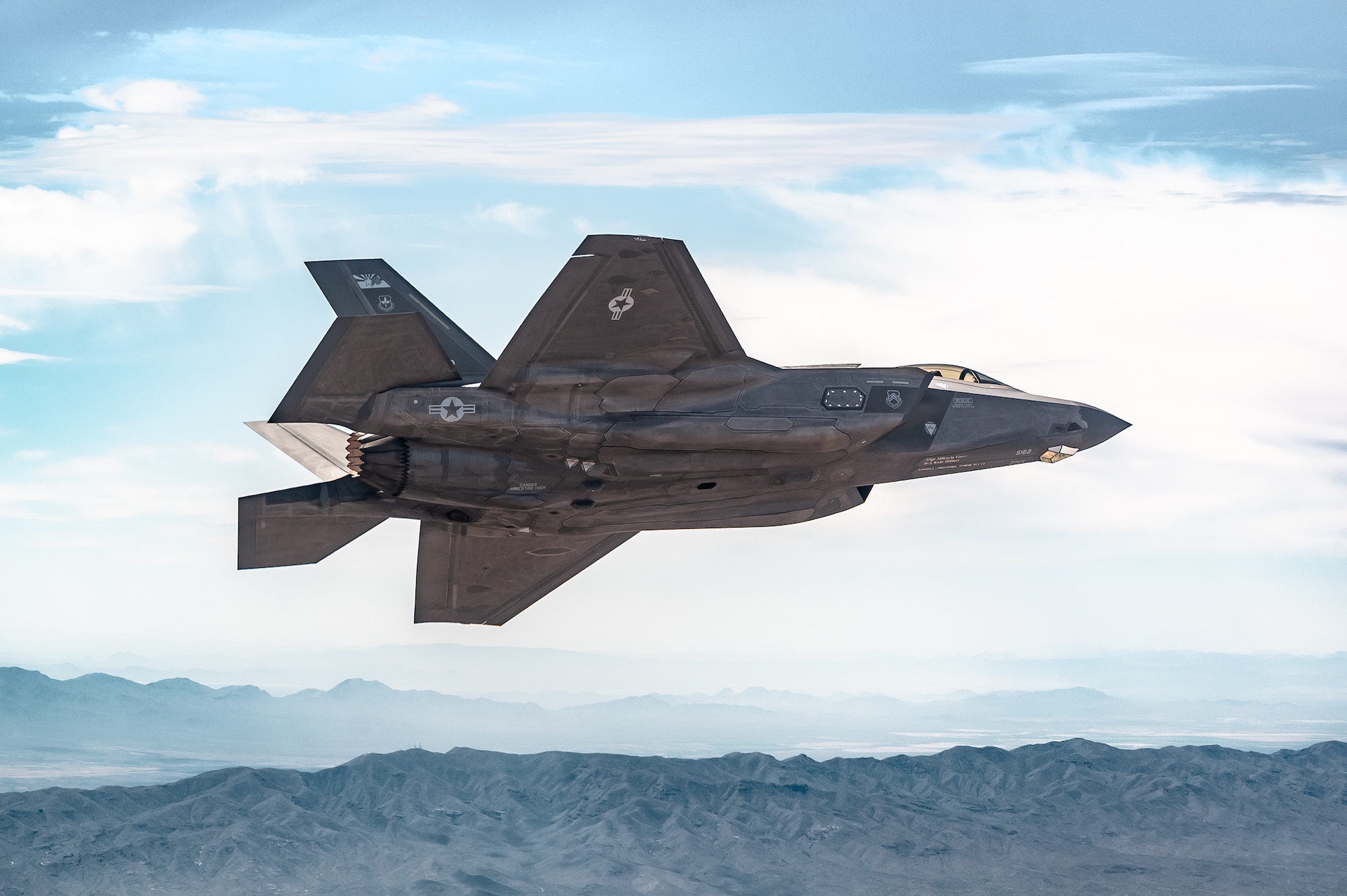 A U.S. Air Force F-35A Lightning II aircraft assigned to the 56th Fighter Wing soars over the Sonoran Desert