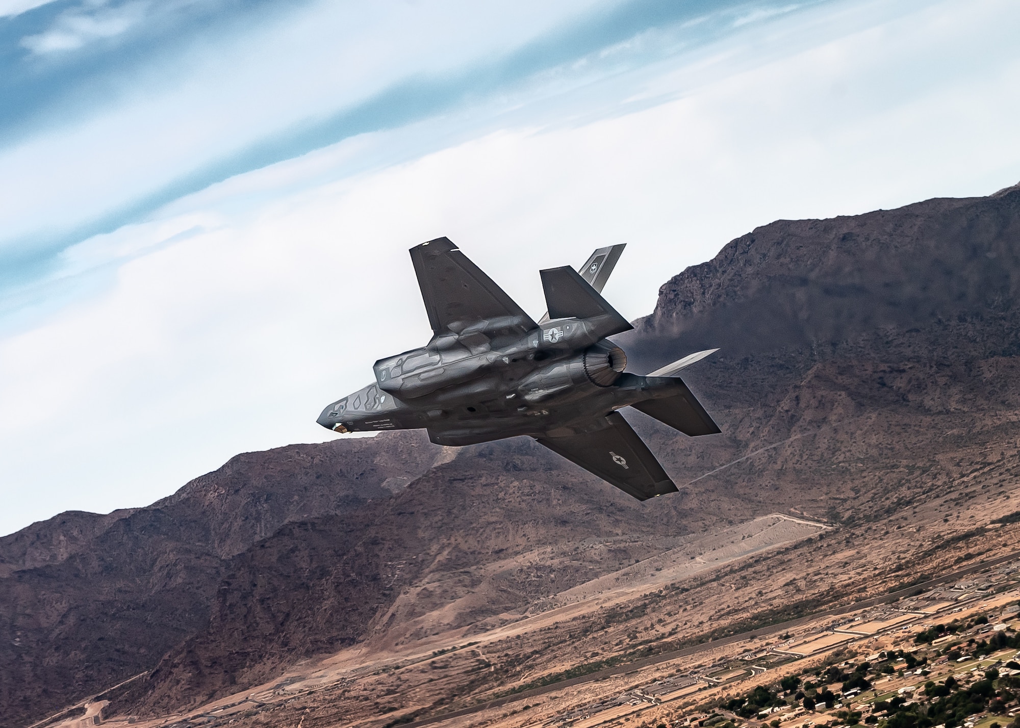 A U.S. Air Force F-35A Lightning II assigned to the 56th Fighter Wing soars over the Sonoran Desert