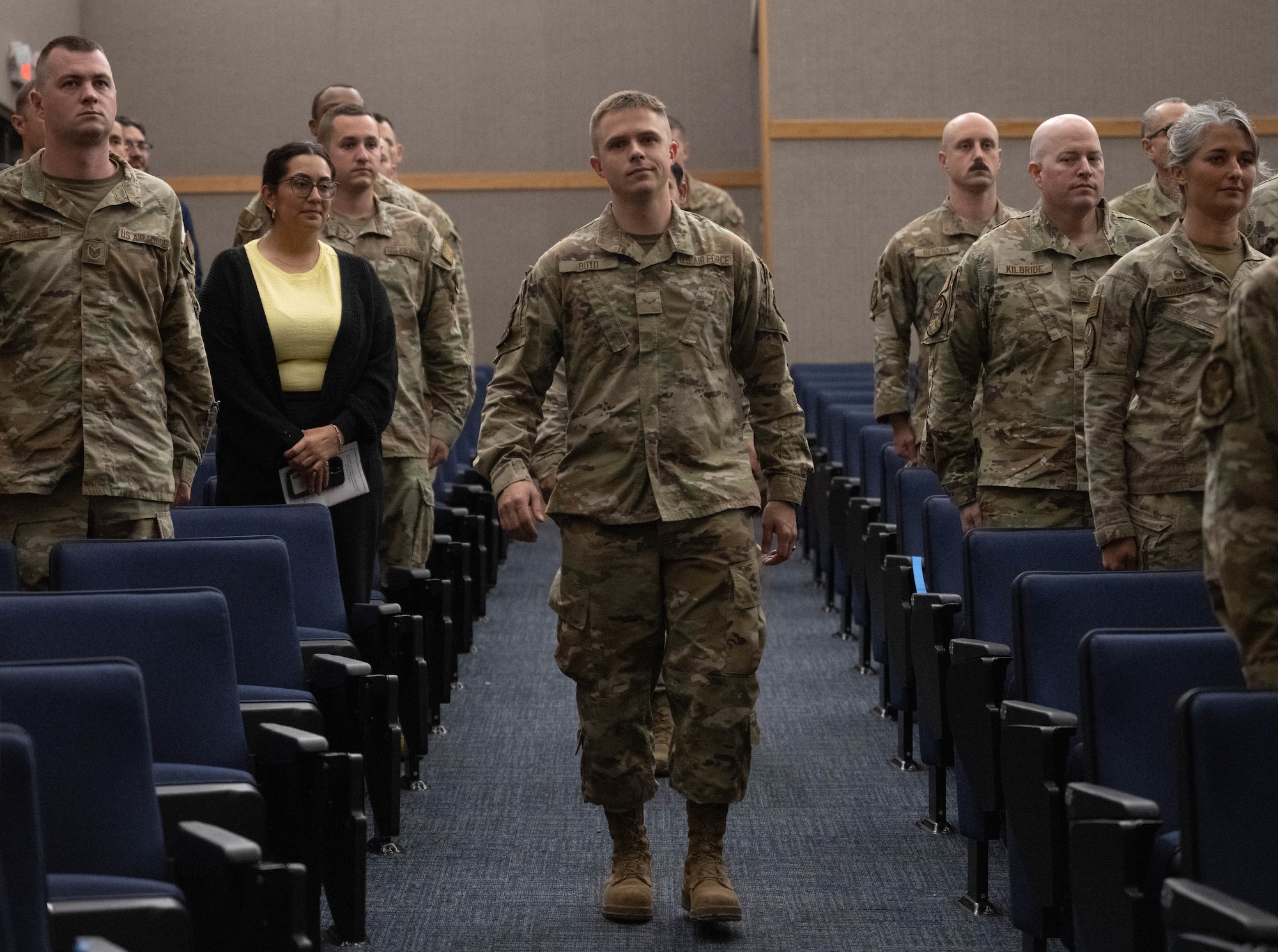 U.S. Air Force Airman 1st Class Connor Boyd, Community College of the Air Force 2025 fall class graduate, walks down the aisle during a graduation ceremony at Laughlin Air Force Base, Texas, April 21, 2026. Boyd was one of over 30 U.S. Air Force Airmen who received diplomas from the CCAF. (U.S. Air Force photo by Airman 1st Class Darryl Keith)