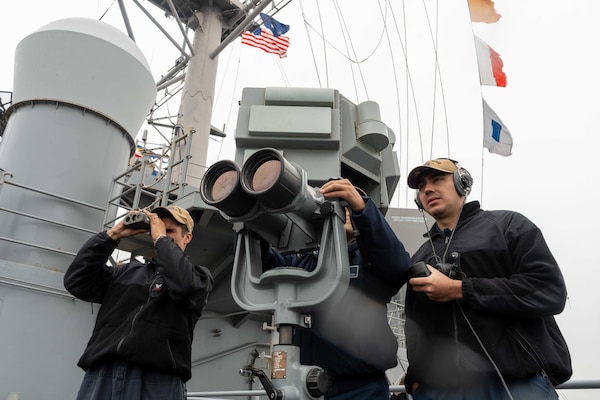Sailors stand watch on the bridge wing aboard U.S. 7th Fleet flagship USS Blue Ridge (LCC 19) as the ship returns to Commander, Fleet Activities Yokosuka, Japan following a patrol in the Indo-Pacific region, April 23, 2026.