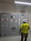 A Soldier looks at a large electrical panel