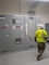 A soldier is near a large electrical panel