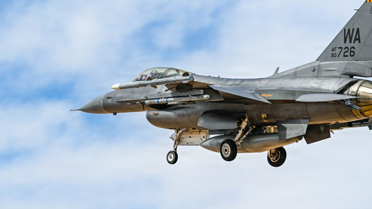 An F-16 Fighting Falcon assigned to the 64th Aggressor Squadron prepares to land at Nellis Air Force Base, Nev., April 2, 2026. The Aggressors replicates adversary tactics, techniques and procedures to train and challenge U.S. and allied aircrews, sharpening combat readiness and ensuring air dominance. (U.S. Air Force photo by Airman Annika Schermerhorn)