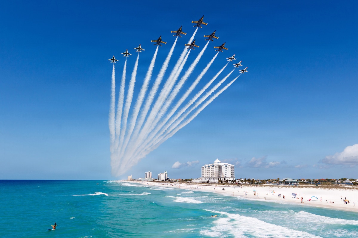 The Navy’s Blue Angels and the Air Force’s Thunderbirds conduct a Super Delta flyover off Pensacola Beach, Fla., April 14, 2026. The Super Delta formation highlights precision, discipline and teamwork. (U.S. Air Force photo)