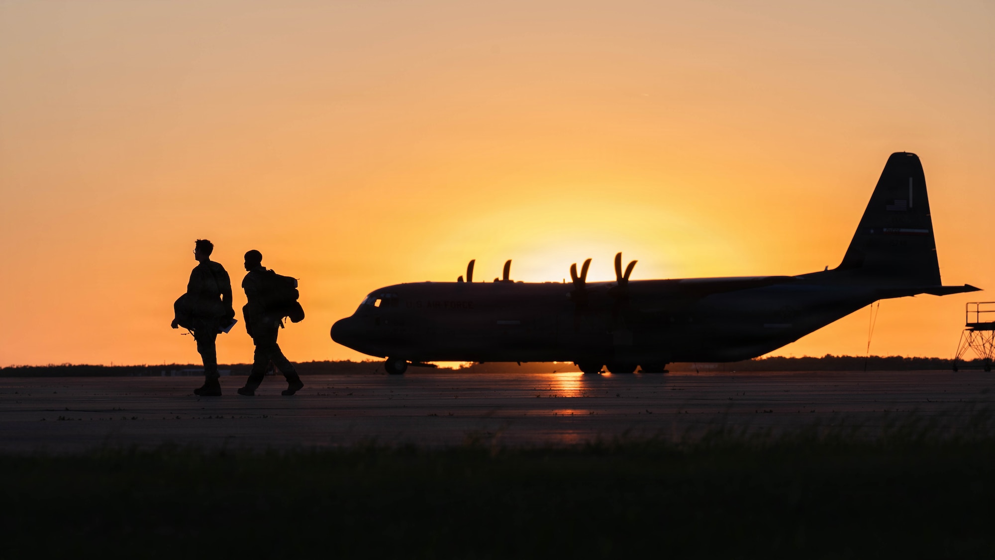 Airmen assigned to the 317th Airlift Wing walk across the flightline in preparation for a maximum endurance operation supporting exercise Balikatan 2026 at Dyess Air Force Base, Texas, April 15, 2026. Balikatan is an annual exercise between the Armed Forces of the Philippines and U.S. military designed to strengthen alliance capabilities and regional security. (U.S. Air Force photo by Airman 1st Class William Neal)