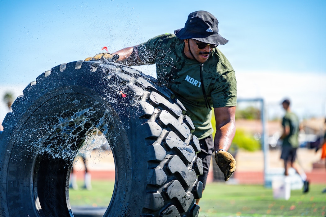 Senior Airman Isaiah Nichols, 99th Communications Squadron, moves a tire during the Nellis Operational Readiness Trials at Nellis Air Force Base, Nev., April 10, 2026. The event tested teamwork, endurance and mission-focused execution across the installation. (U.S. Air Force photo by Airman Annika Schermerhorn)