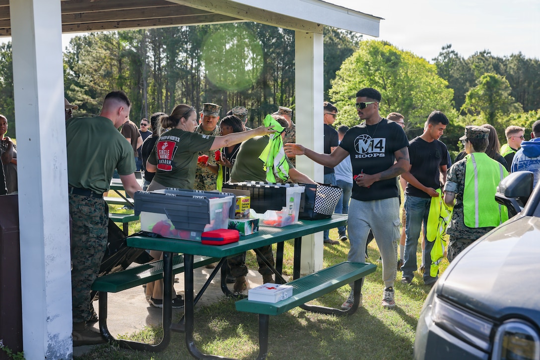 U.S. Marines and French Creek Single Marine Program staff prepare for a Days of Service trash clean up event on Marine Corps Base Camp Lejeune, North Carolina, April 22, 2026. The cleanup supported MCB Camp Lejeune Environmental Management Division's Earth Day 2026 initiatives, emphasizing the importance of sustaining the installation by removing litter and promoting environmental responsibility. (U.S. Marine Corps photo by Lance Cpl. Alyssa J. DeCrane)