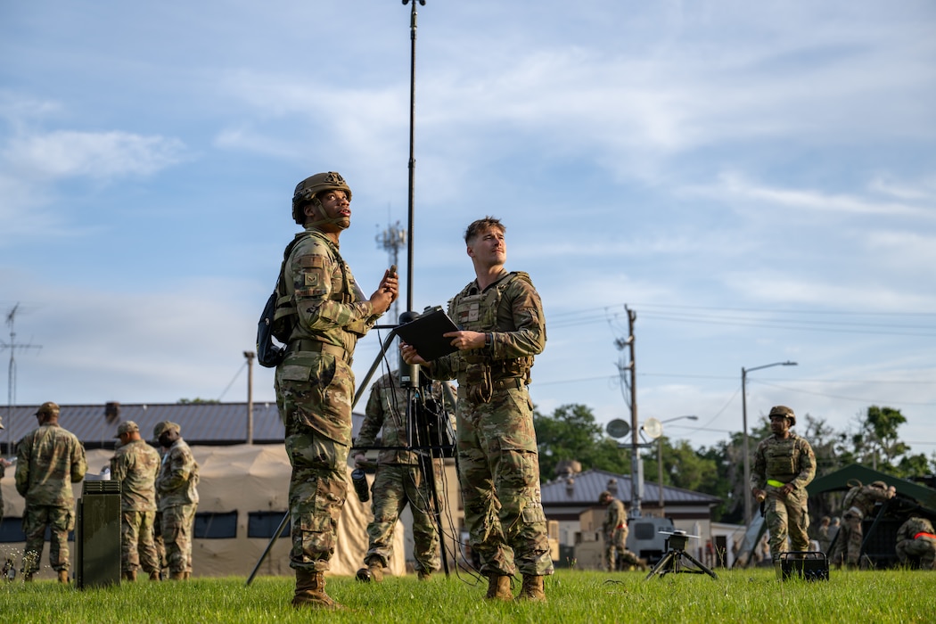 People stand and observe the area.